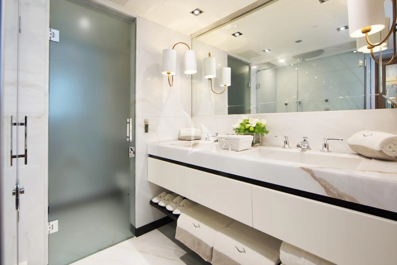 a bathroom with a large mirror aboard BEATRIX Yacht for Sale