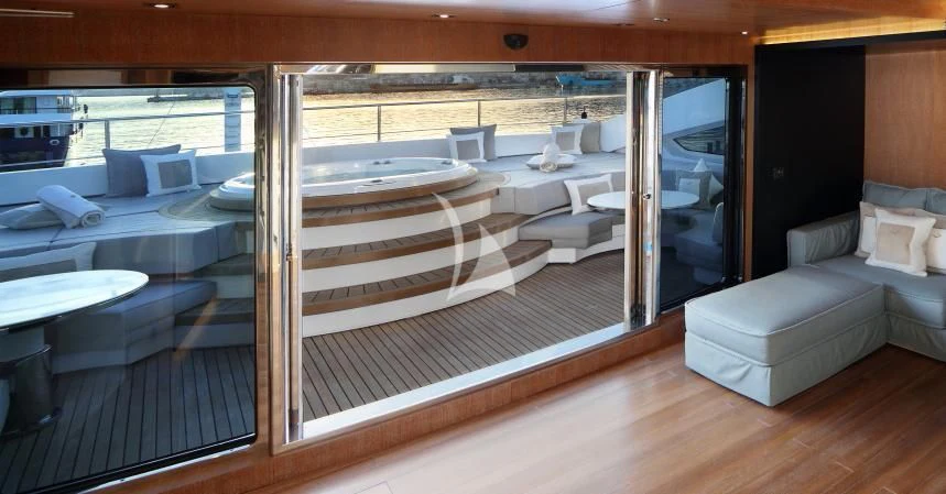 a room with a bed and a couch aboard BEATRIX Yacht for Sale