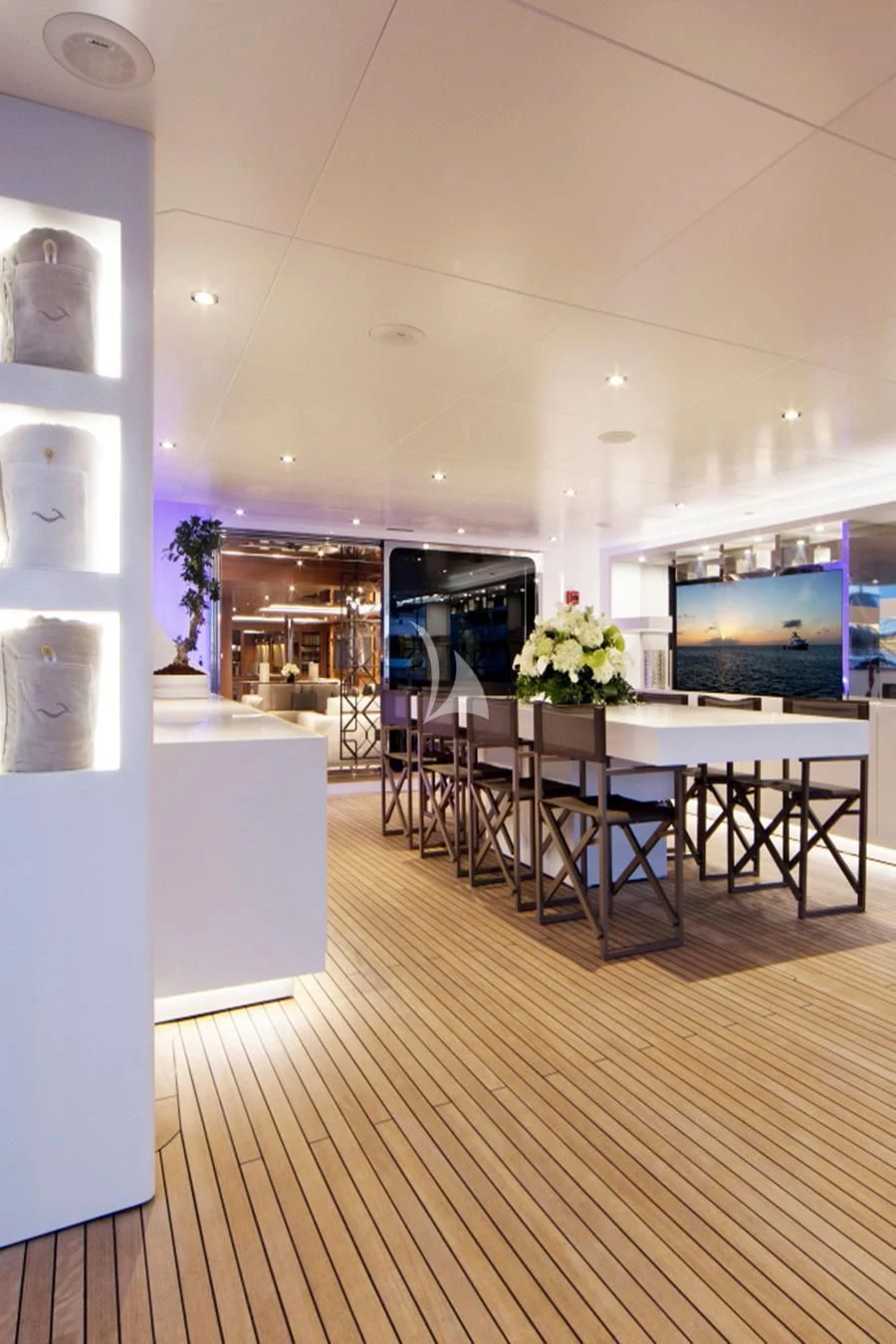 a room with a table and chairs aboard BEATRIX Yacht for Sale