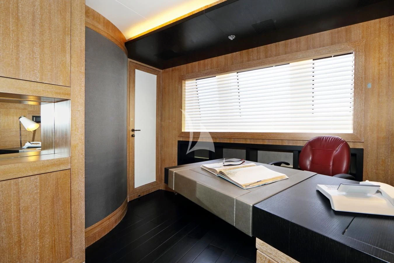 a room with a desk and chairs aboard BEATRIX Yacht for Sale