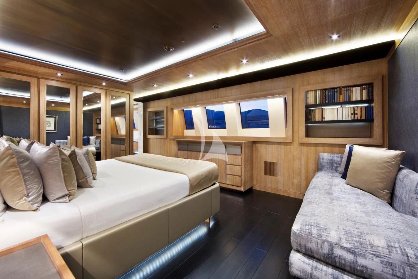 a room with a bed and a couch aboard BEATRIX Yacht for Sale