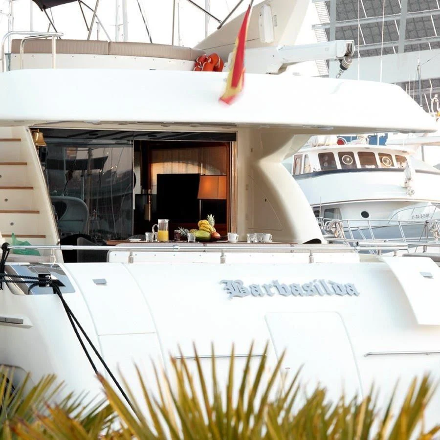 a white boat with a red bow aboard BARBASILDA Yacht for Sale