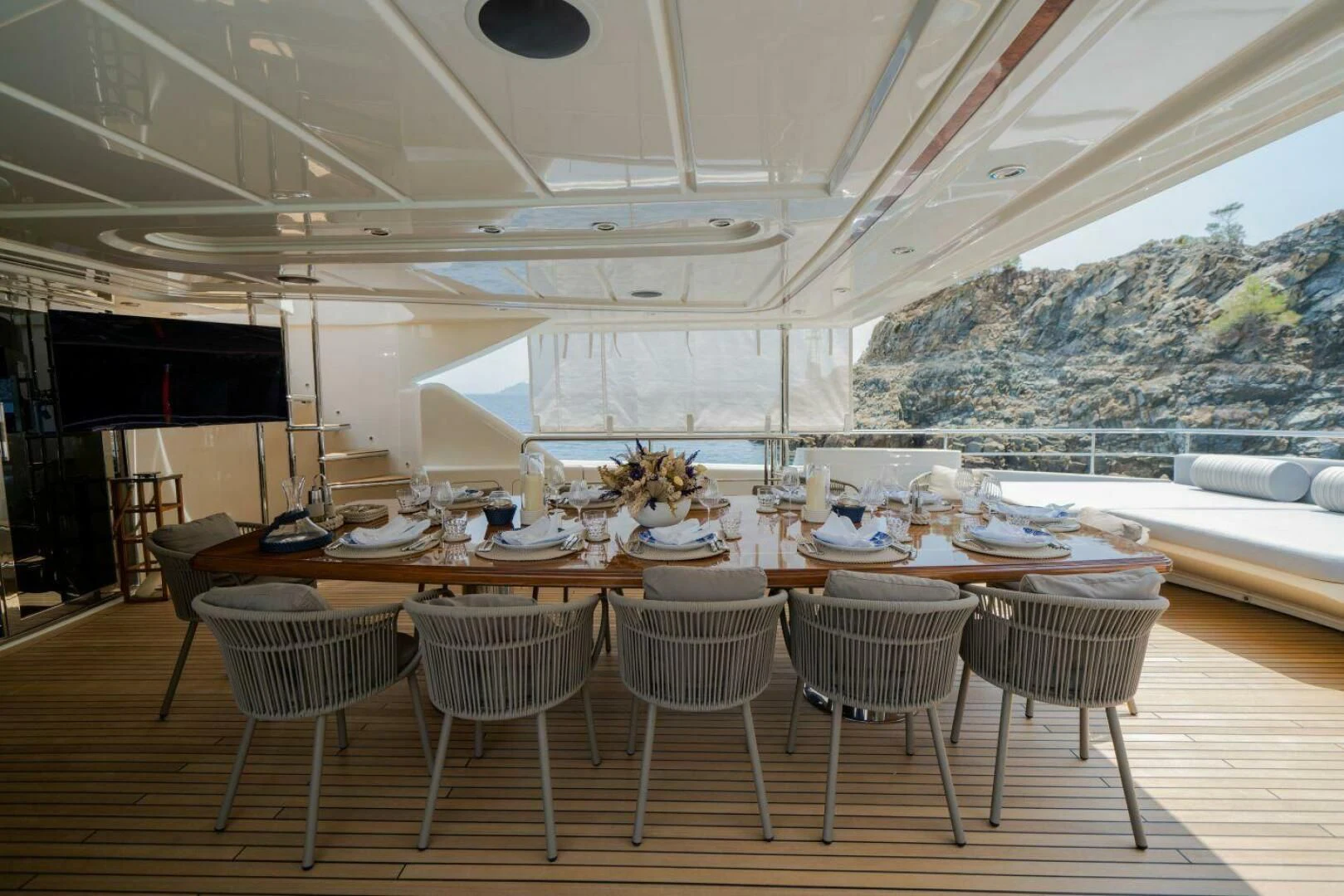 a room with tables and chairs aboard ARIELA Yacht for Sale