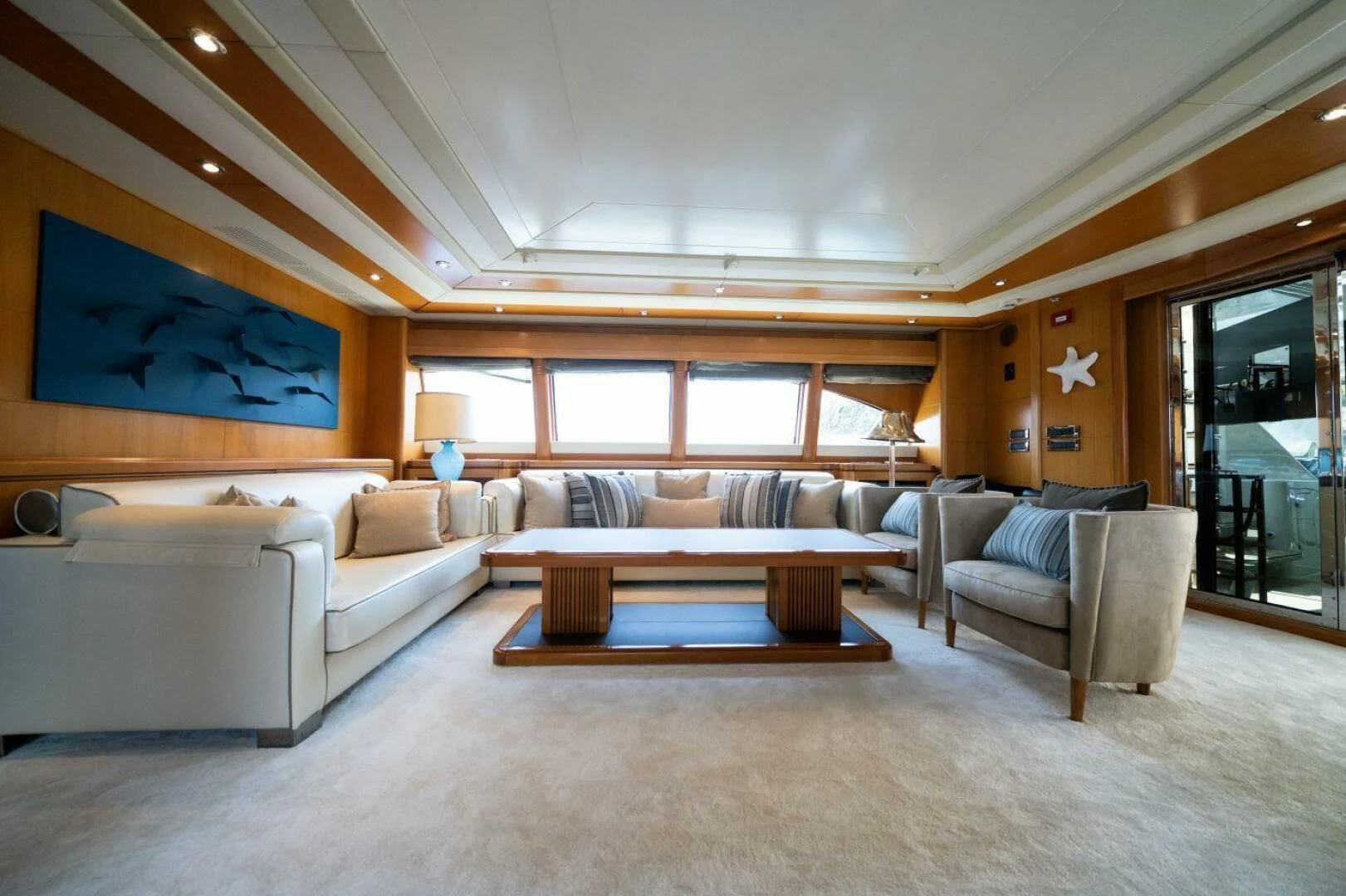 a living room with a couch and a coffee table aboard ARIELA Yacht for Sale