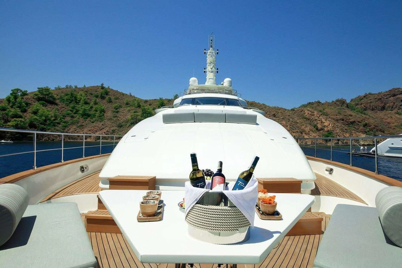 a white boat on a deck aboard ARIELA Yacht for Sale