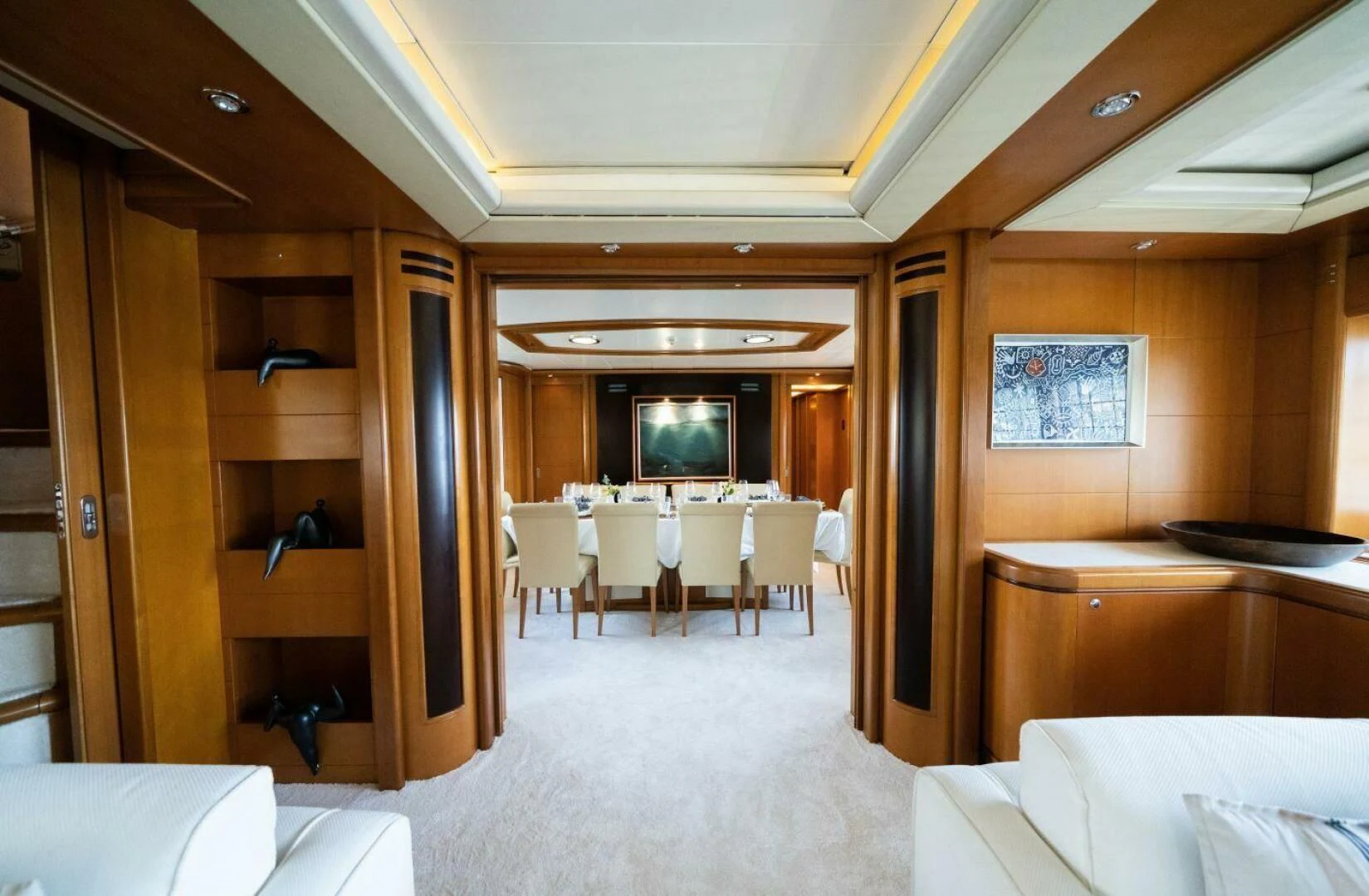 a room with tables and chairs aboard ARIELA Yacht for Sale