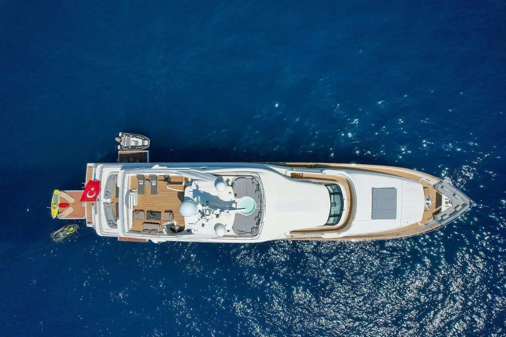 a toy ship in the water aboard ARIELA Yacht for Sale