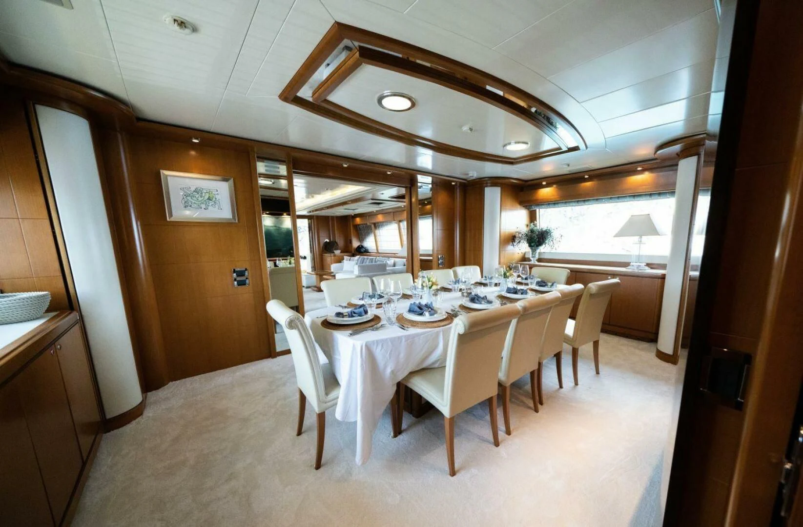 a dining room with tables and chairs aboard ARIELA Yacht for Sale