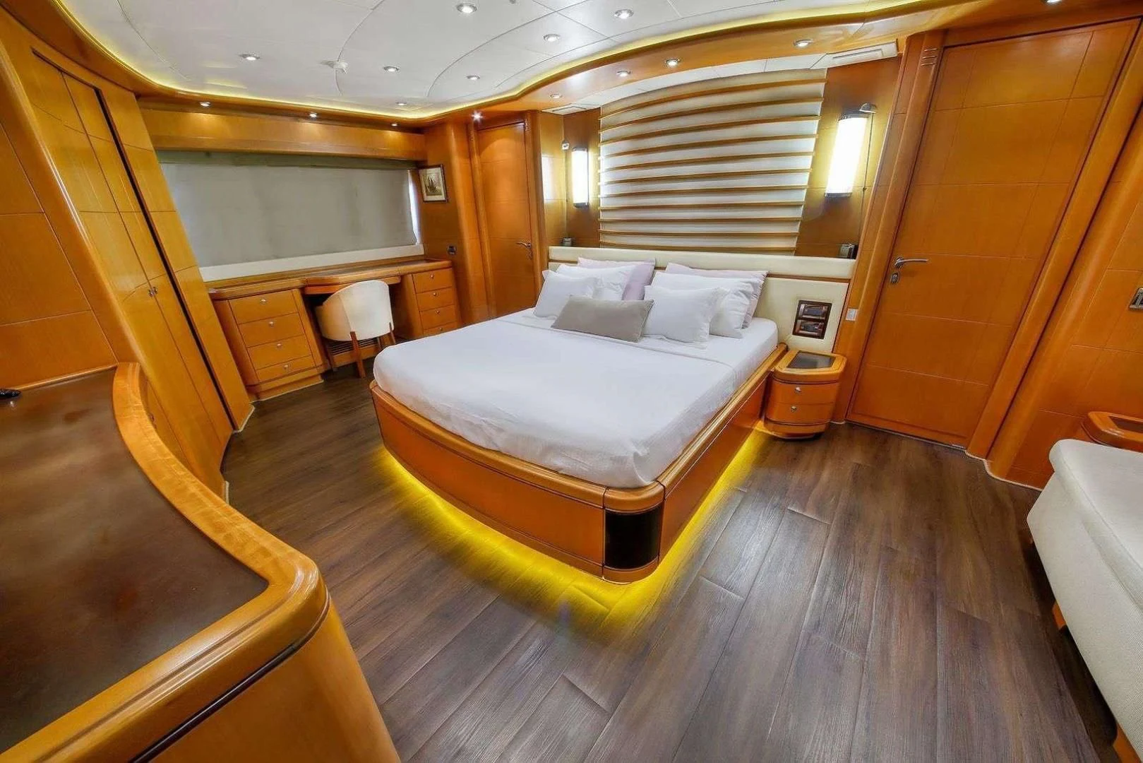 a room with a bed and a desk aboard ARIELA Yacht for Sale