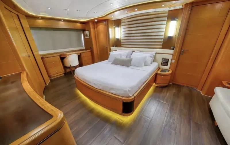 a bed in a room aboard ARIELA Yacht for Sale