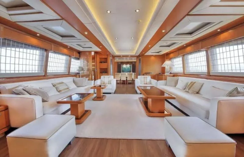 a large living room with a large window aboard ARIELA Yacht for Sale