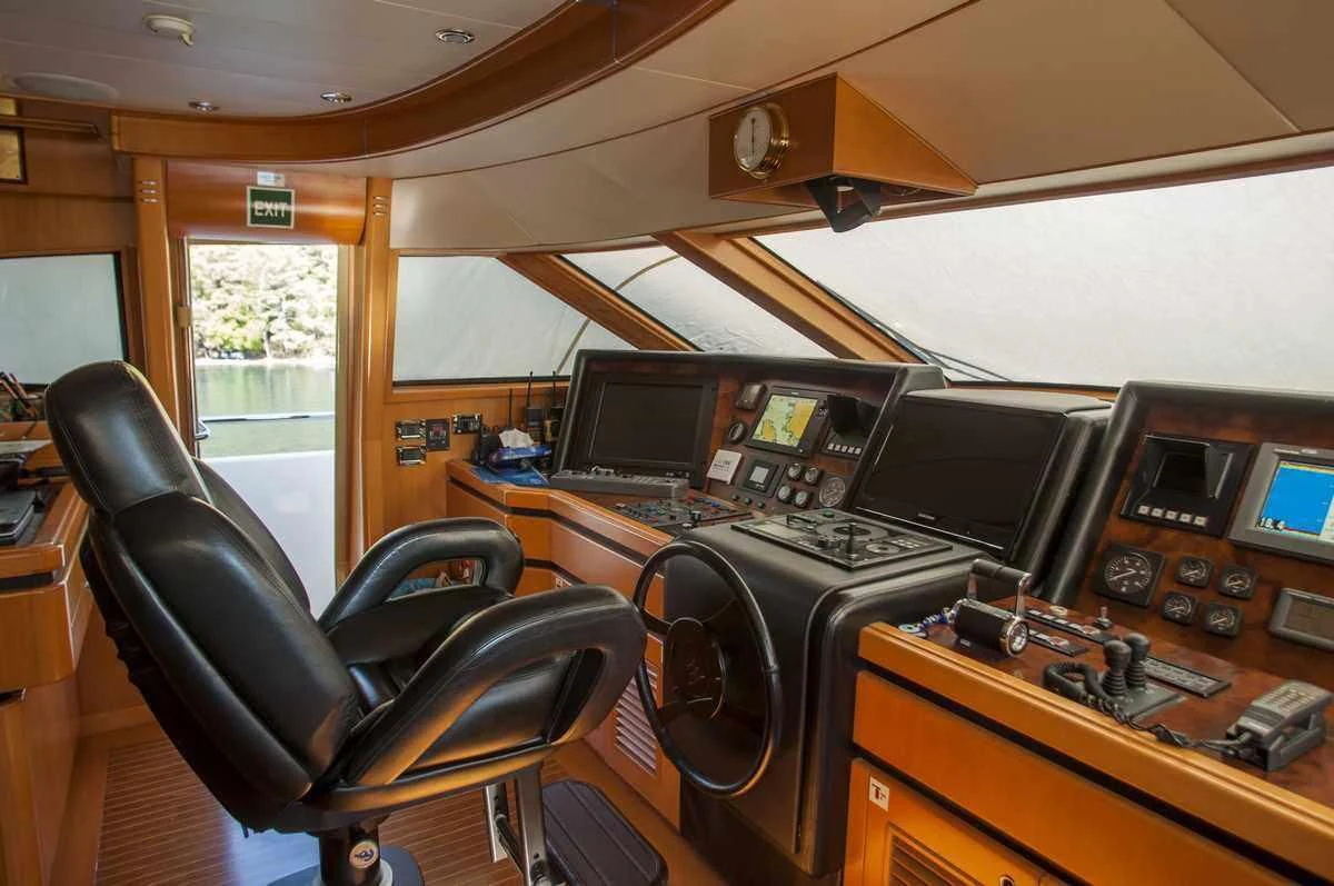 a room with a desk and computers aboard ARIELA Yacht for Sale