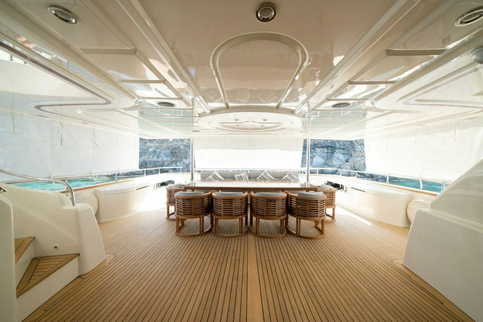 inside of a large room with a large table and chairs aboard ARIELA Yacht for Sale