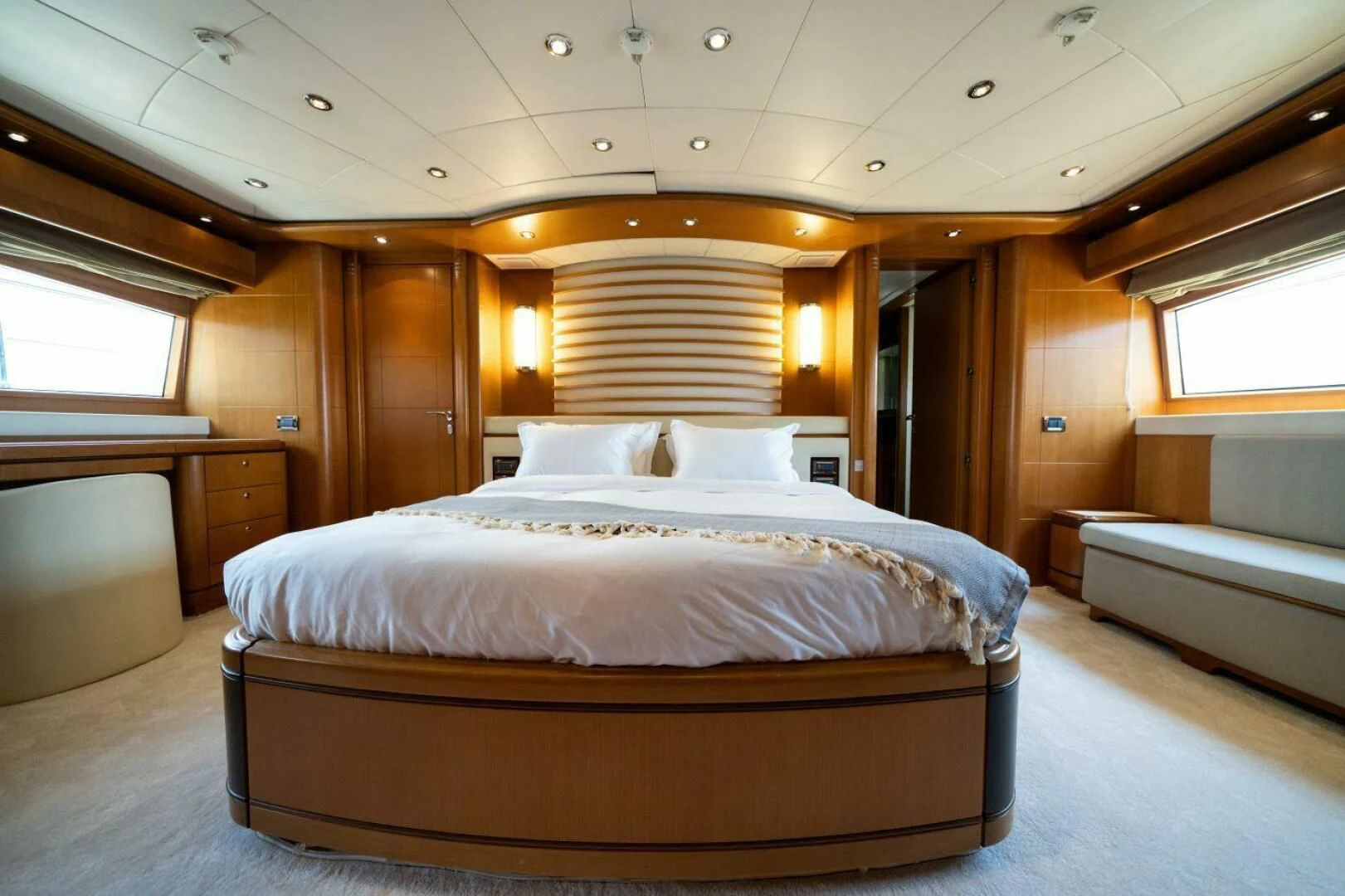 a large bed in a room aboard ARIELA Yacht for Sale