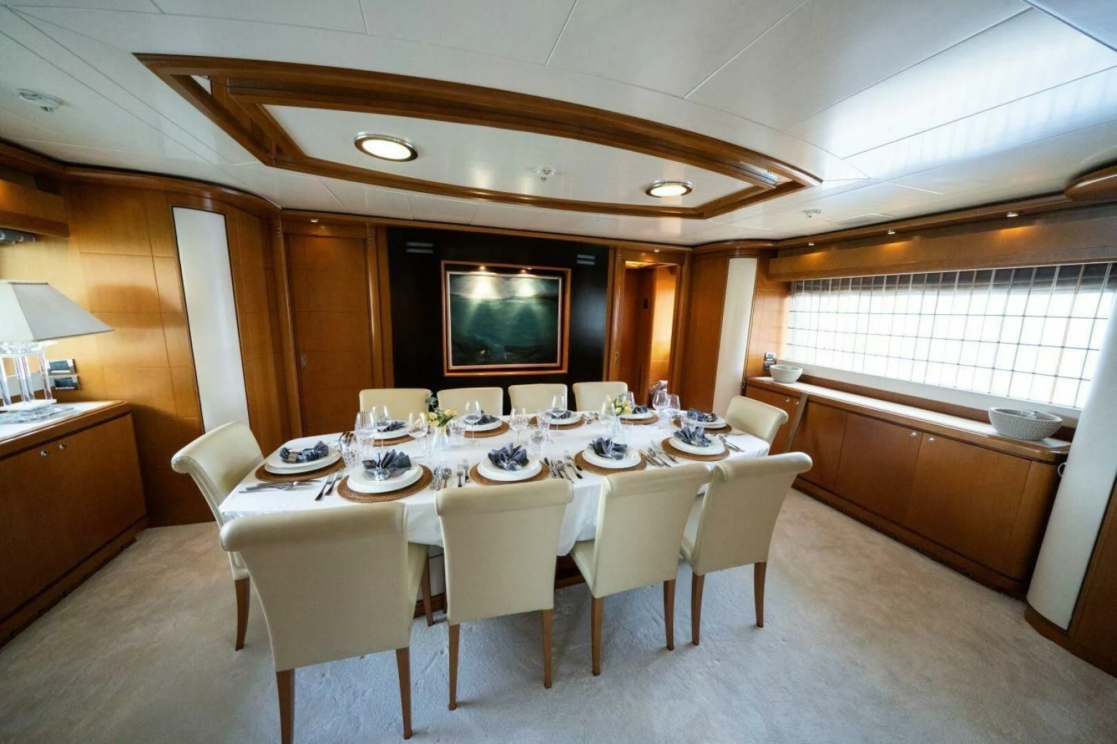 a dining room with a table and chairs aboard ARIELA Yacht for Sale