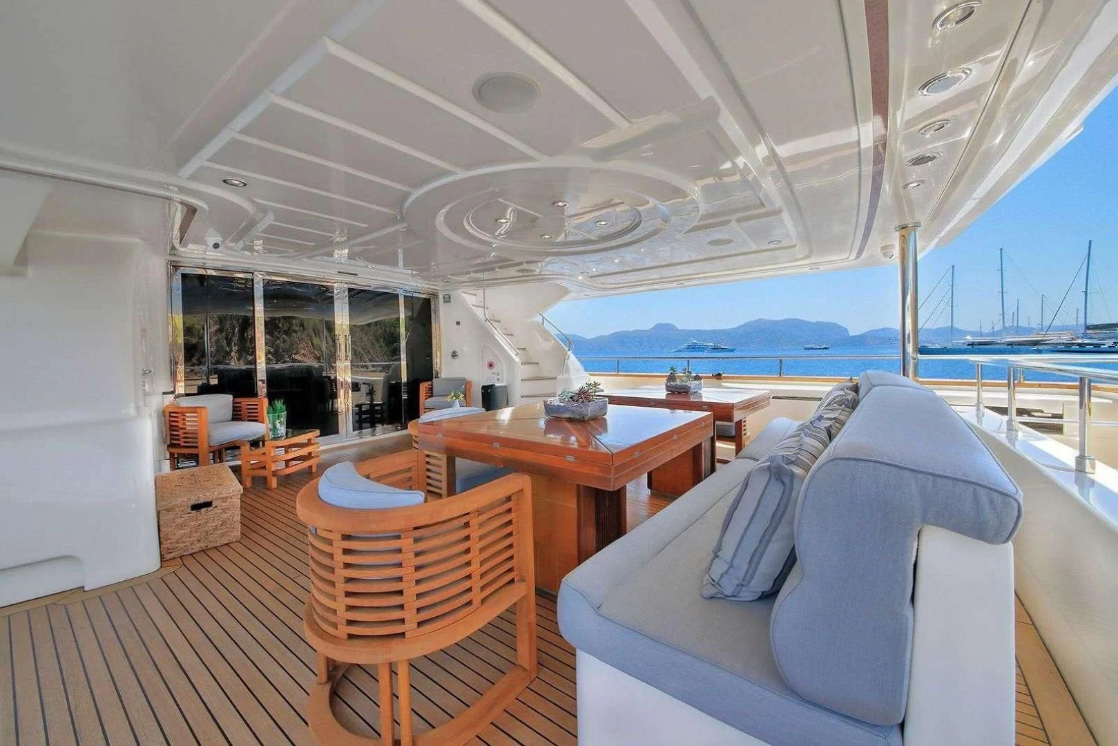 a room with a table and chairs aboard ARIELA Yacht for Sale