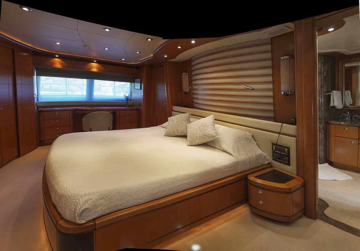 a bed in a room aboard ARIELA Yacht for Sale