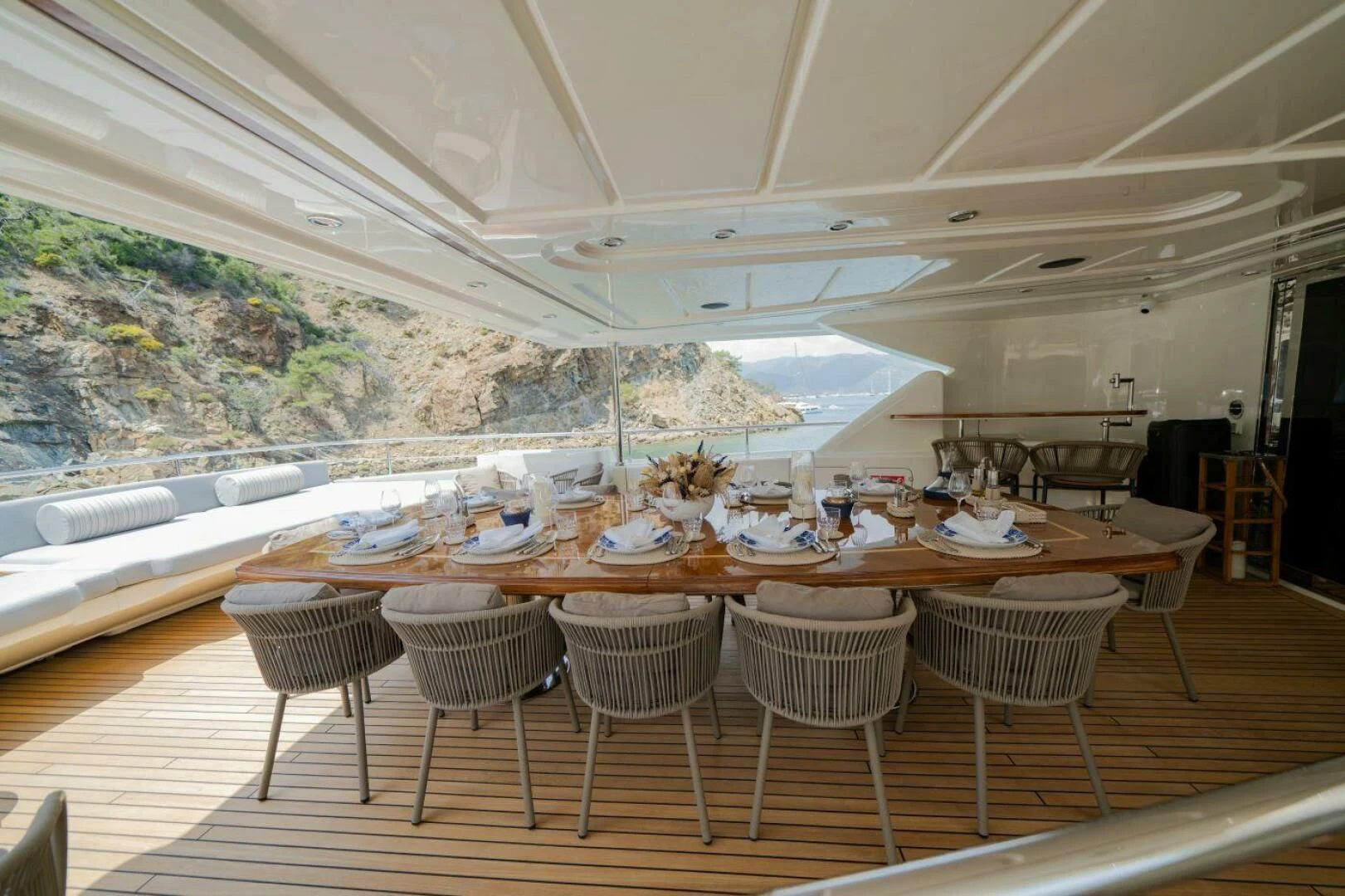 a large dining room with a large table and chairs aboard ARIELA Yacht for Sale