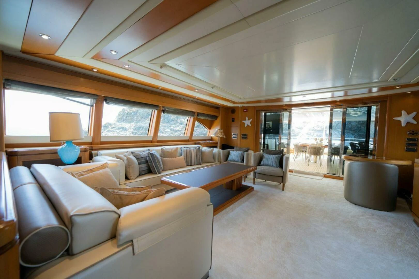 a living room with a large window aboard ARIELA Yacht for Sale
