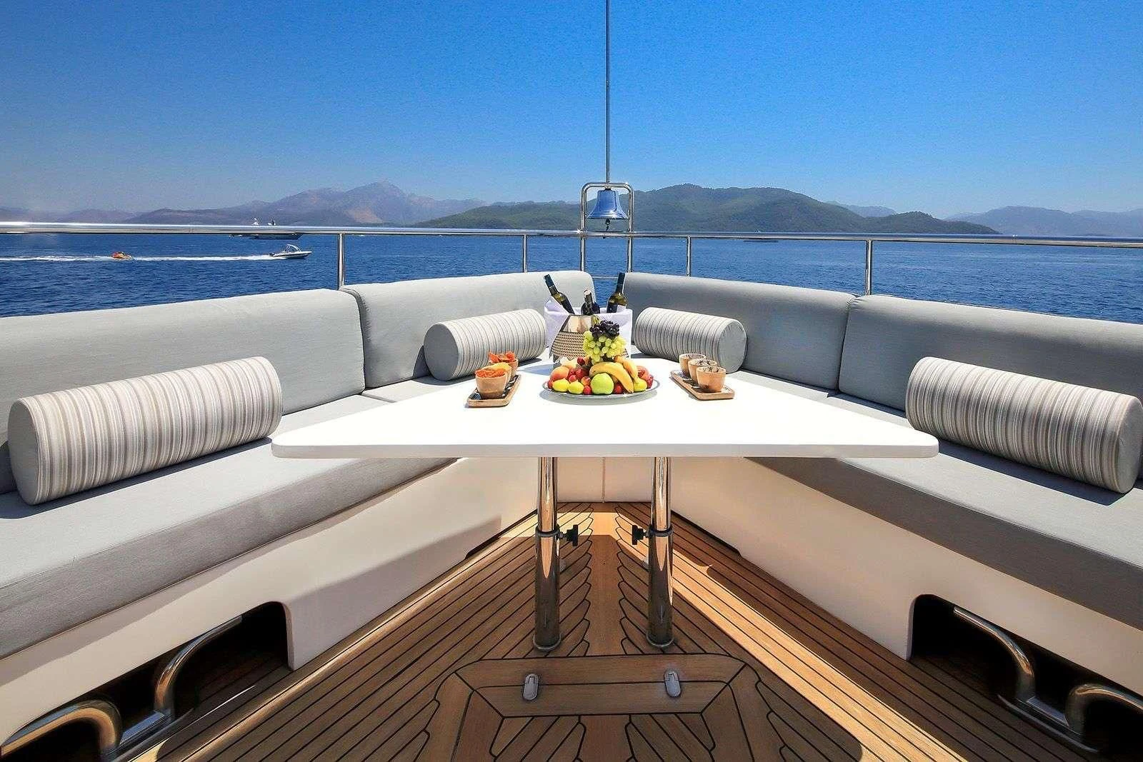 a white table on a boat aboard ARIELA Yacht for Sale