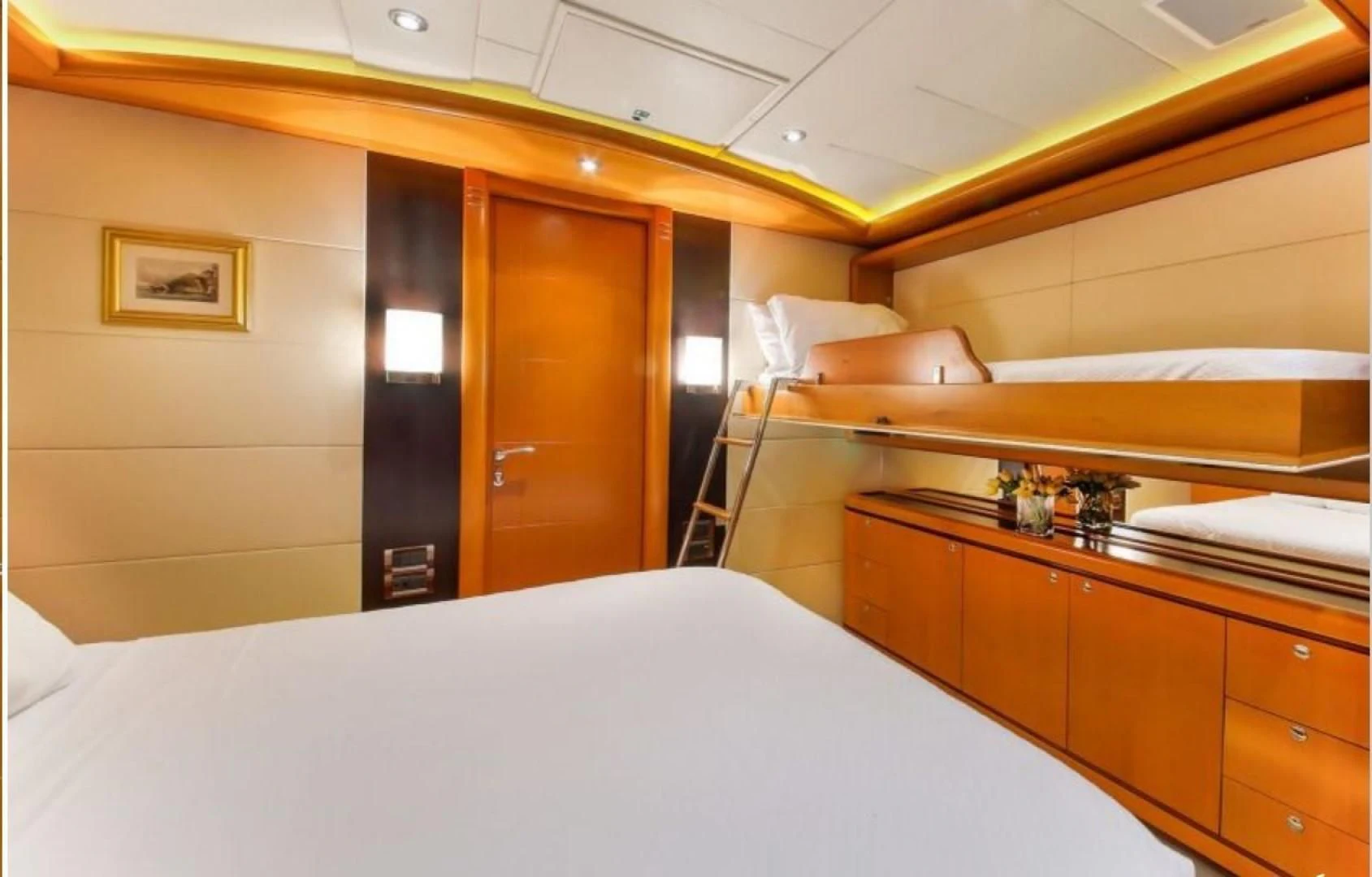 a room with a bed and a desk aboard ARIELA Yacht for Sale