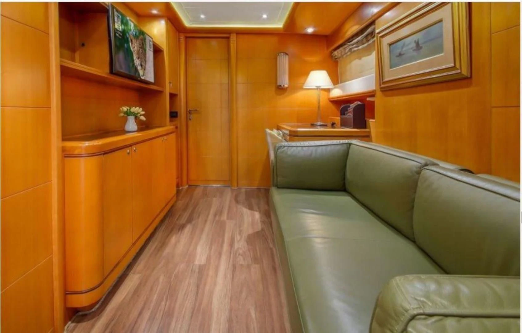a living room with a couch and a table aboard ARIELA Yacht for Sale