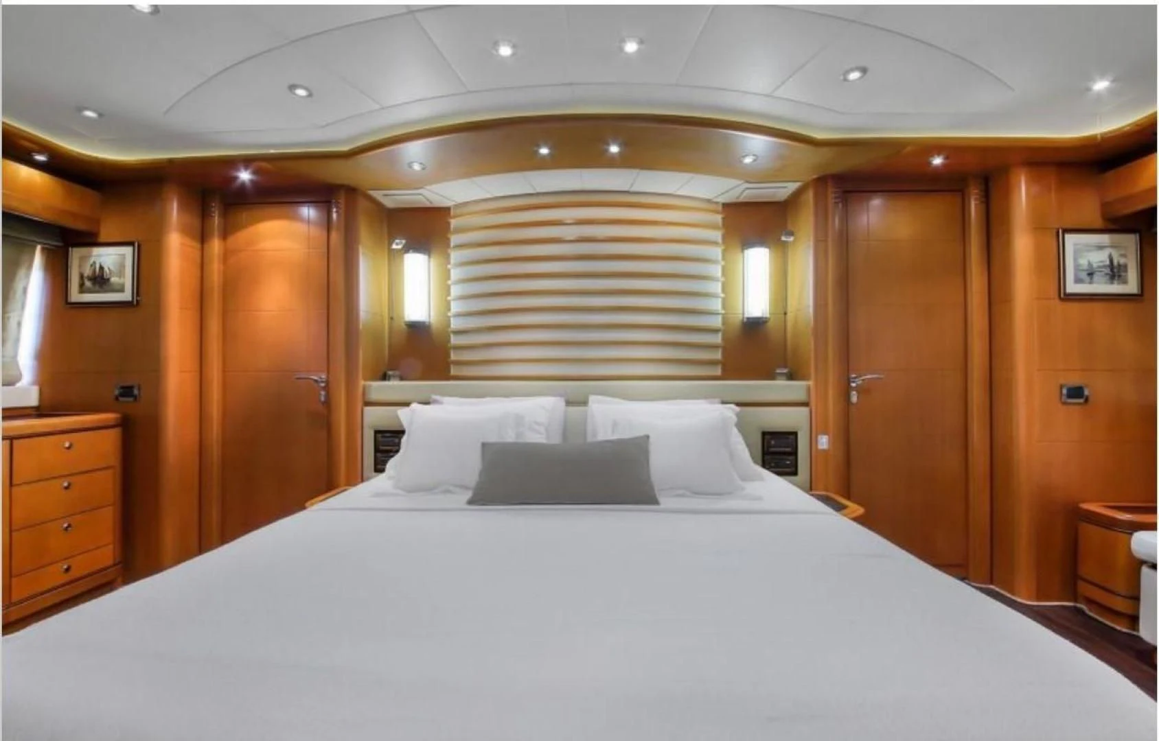 a bed with white sheets aboard ARIELA Yacht for Sale