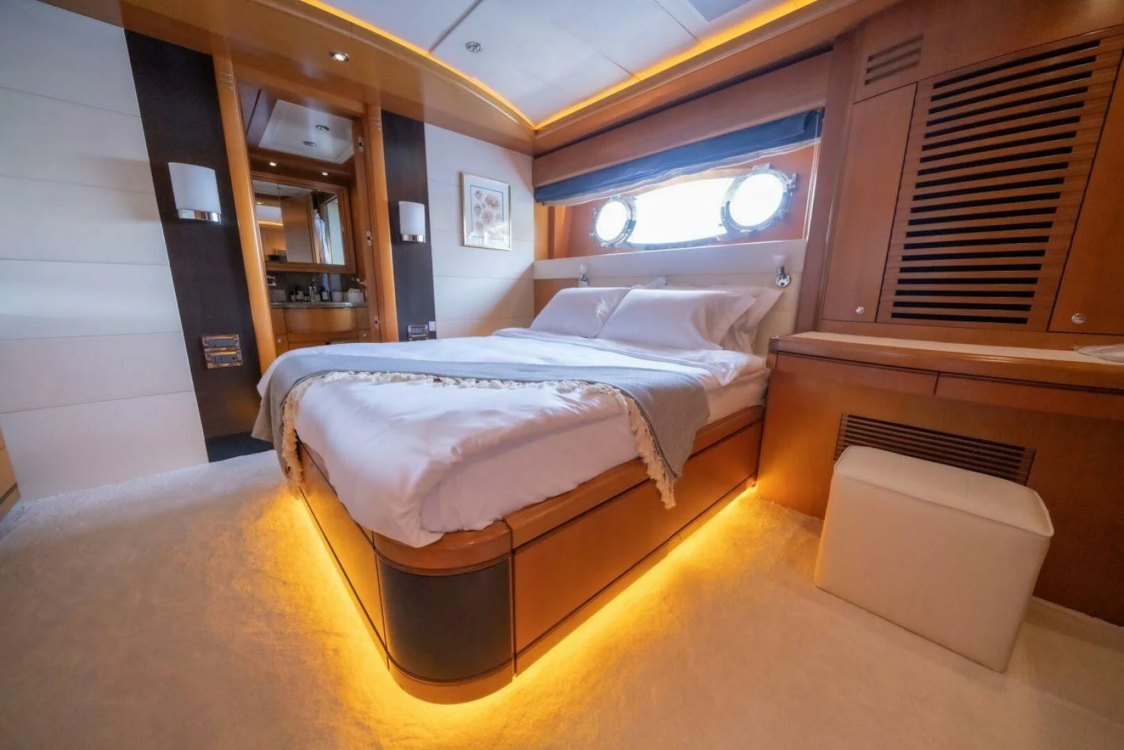 a room with a bed and a desk aboard ARIELA Yacht for Sale