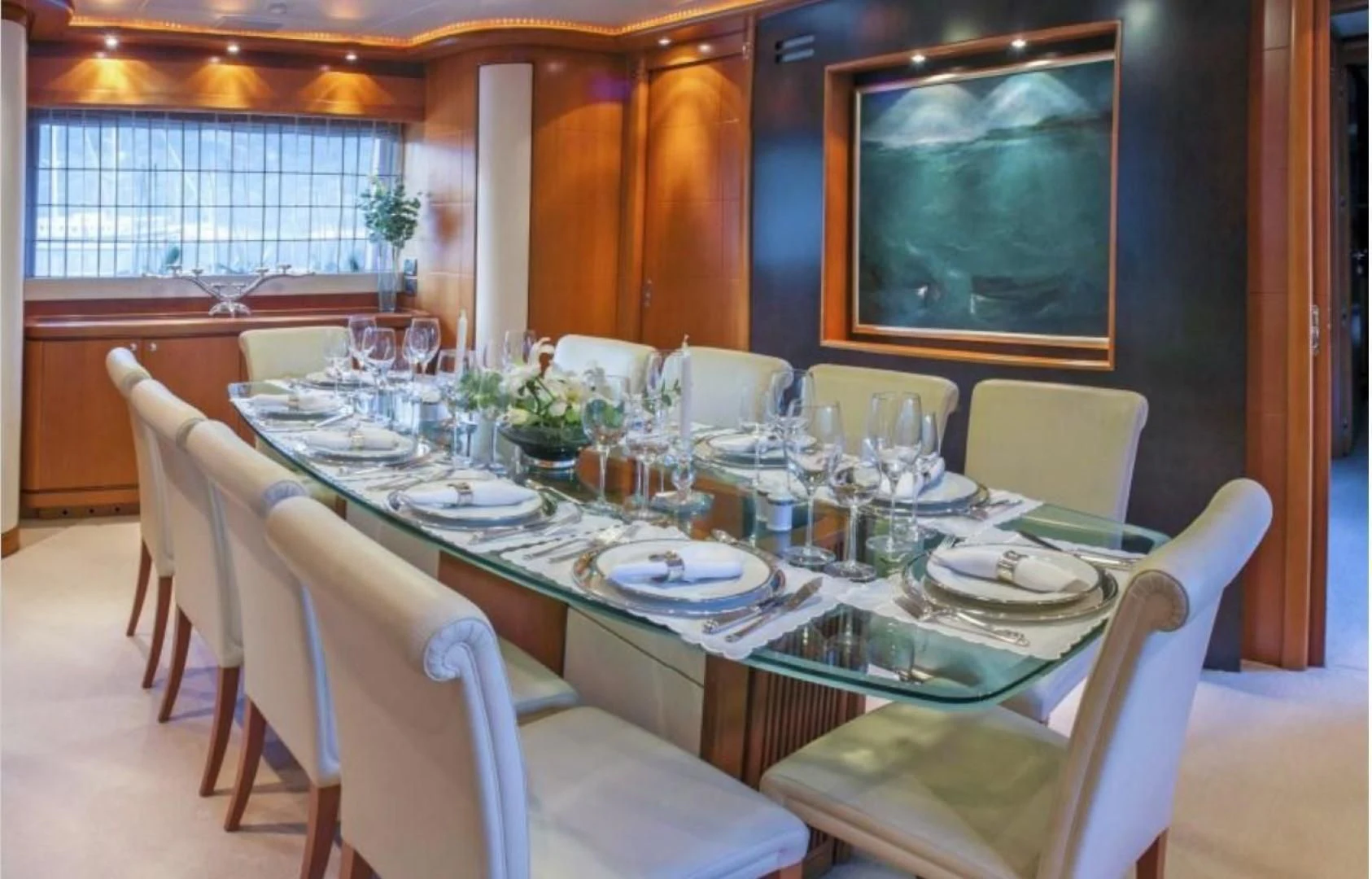 a dining table set for a dinner aboard ARIELA Yacht for Sale