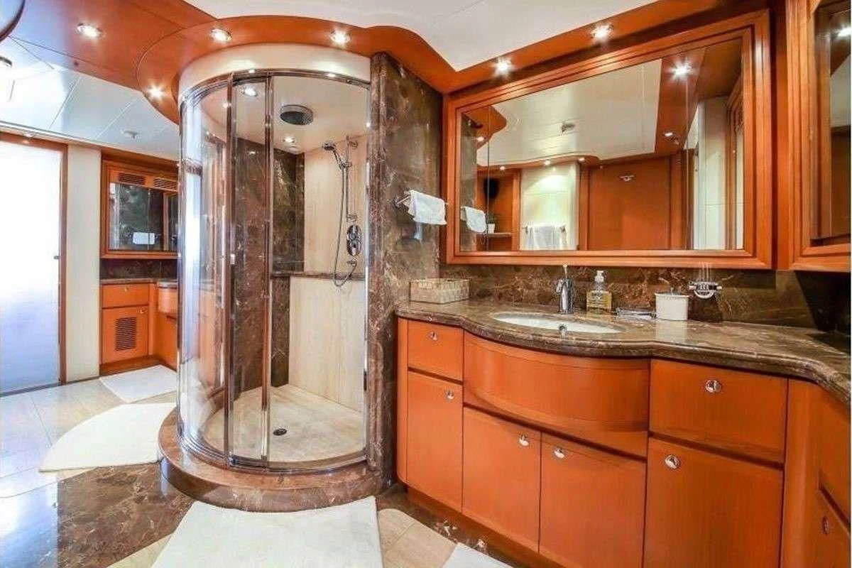 a bathroom with a large shower aboard ARIELA Yacht for Sale