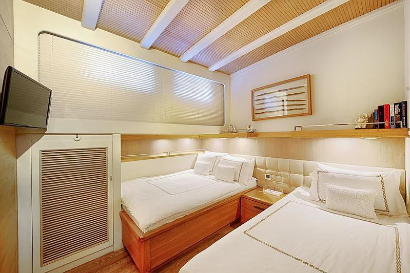a room with two beds aboard COBRA KING Yacht for Sale