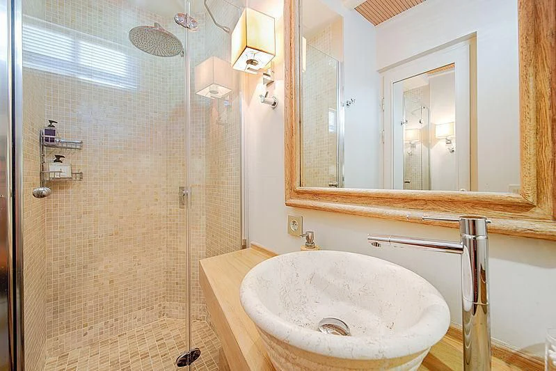 a bathroom with a sink and a shower aboard COBRA KING Yacht for Sale