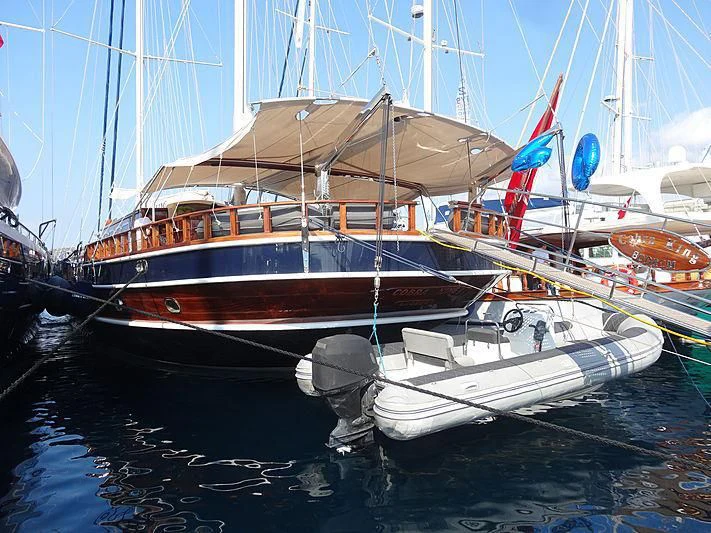 a couple of boats are parked in a harbor aboard COBRA KING Yacht for Sale