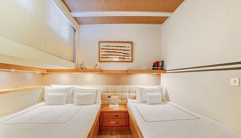 a room with two beds aboard COBRA KING Yacht for Sale