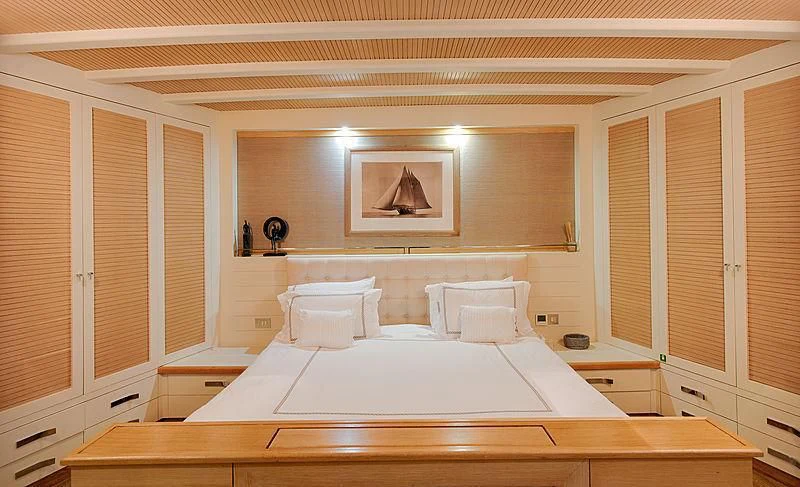 a large white bed in a room aboard COBRA KING Yacht for Sale