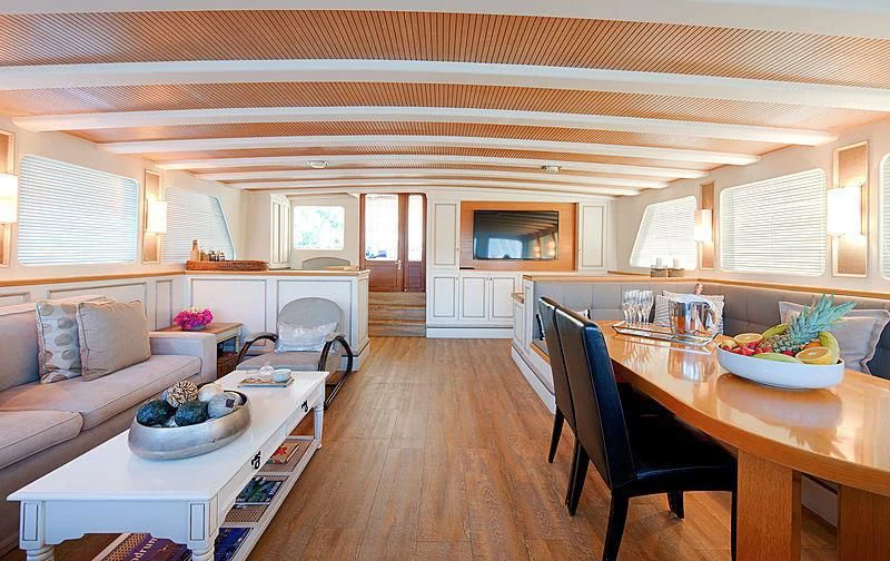 a living room with a wood floor aboard COBRA KING Yacht for Sale