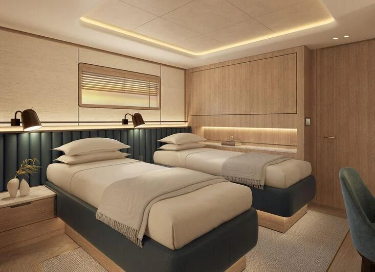 a room with a bed and a chair aboard SEAWOLF X Yacht for Sale