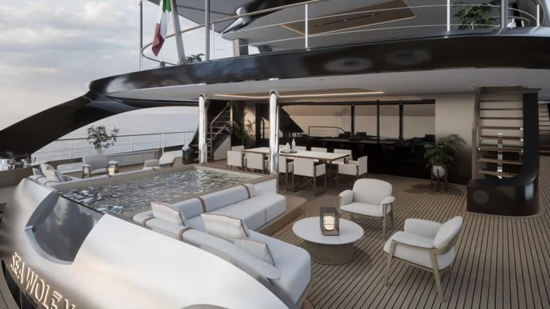 a room with a large white couch and a table with chairs aboard SEAWOLF X Yacht for Sale