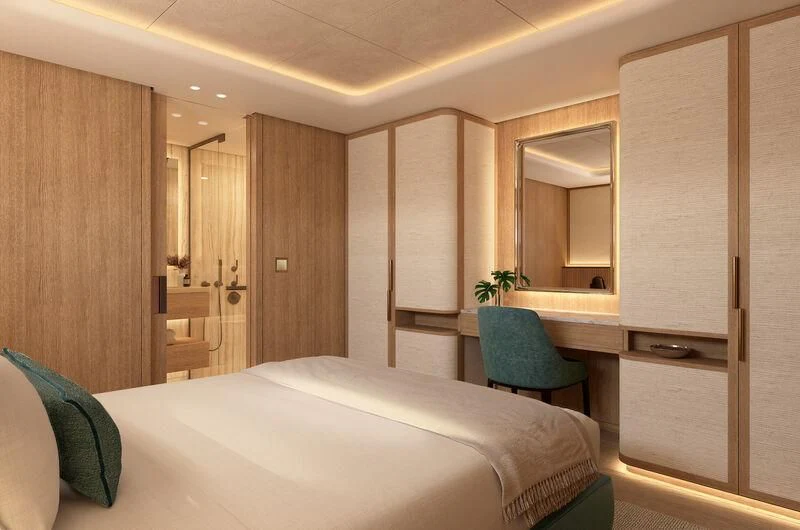 a room with a bed and a chair aboard SEAWOLF X Yacht for Sale