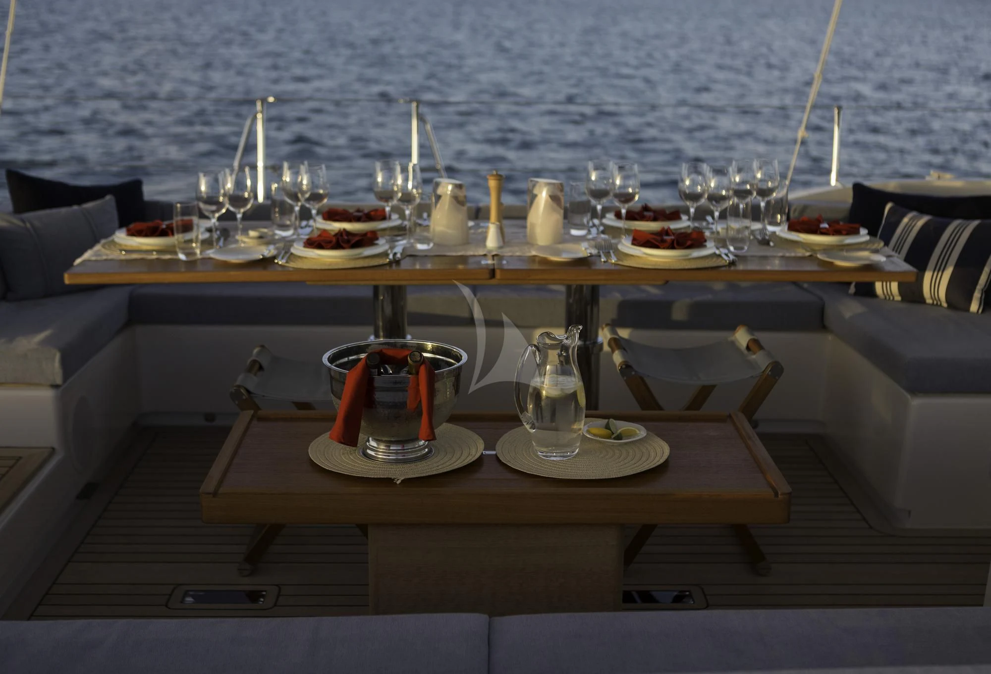 a table with food and glasses on it aboard FARFALLA Yacht for Sale