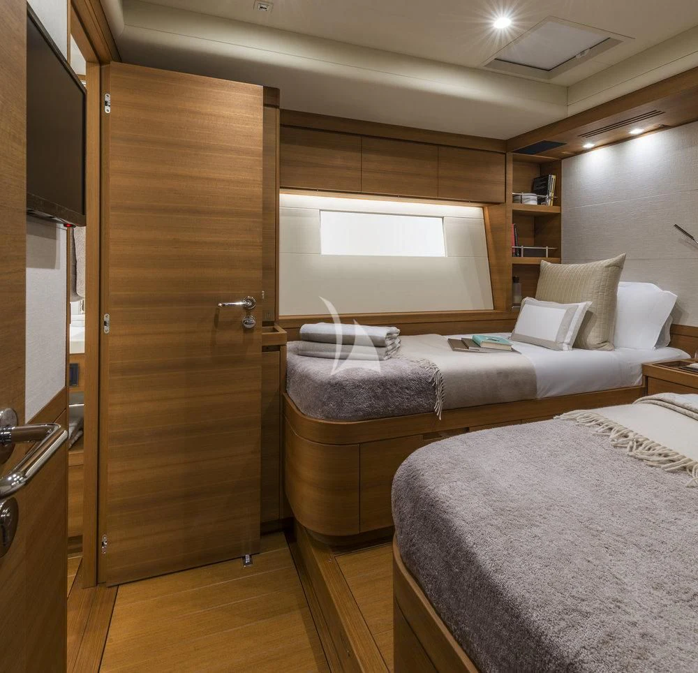 a room with a bed and a desk aboard FARFALLA Yacht for Sale