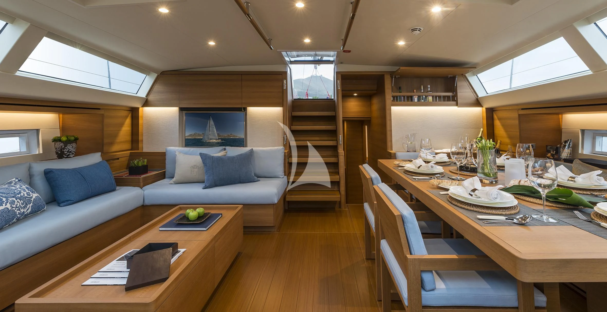 a living room with a couch and a table aboard FARFALLA Yacht for Sale