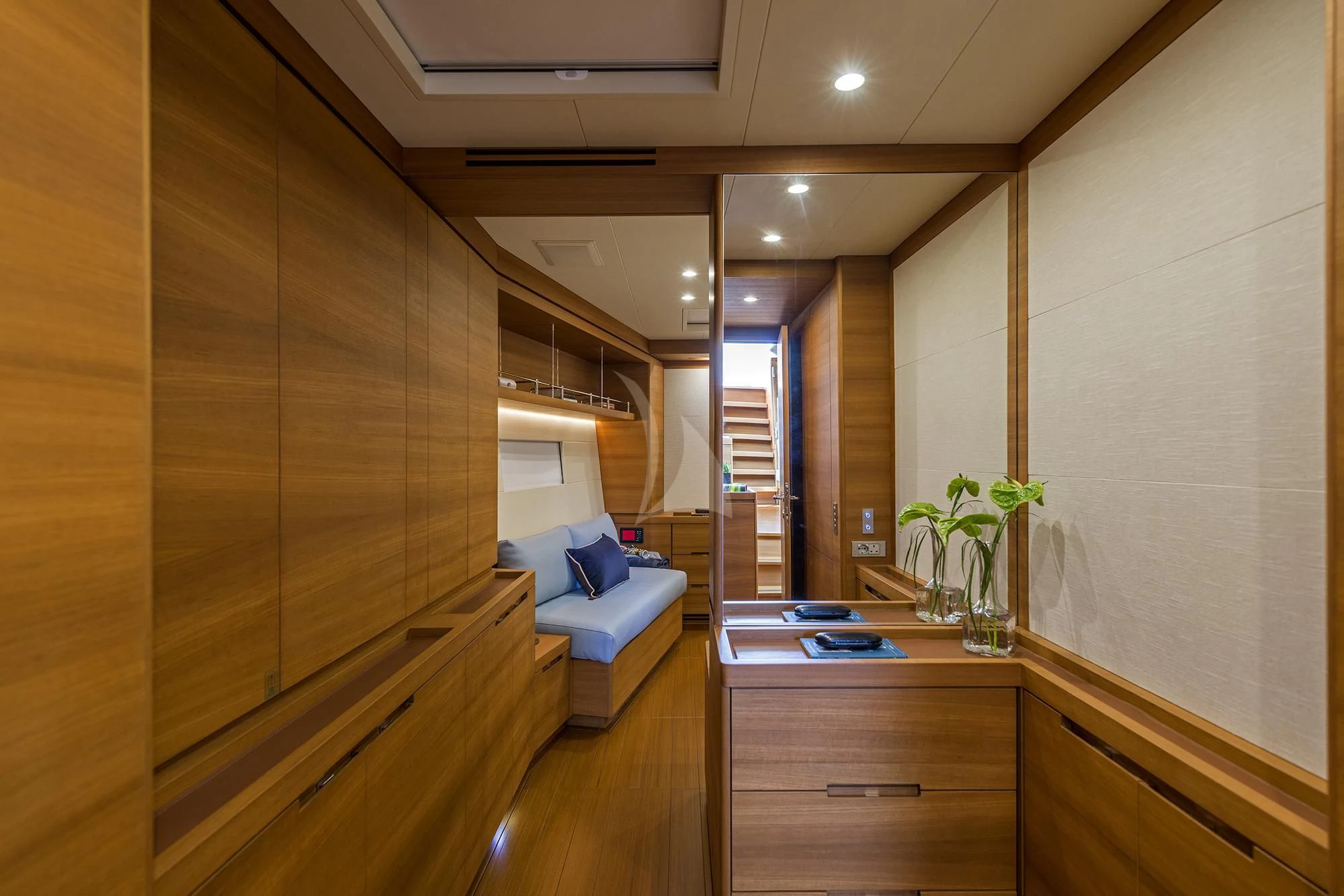 a room with a wood floor and a couch aboard FARFALLA Yacht for Sale