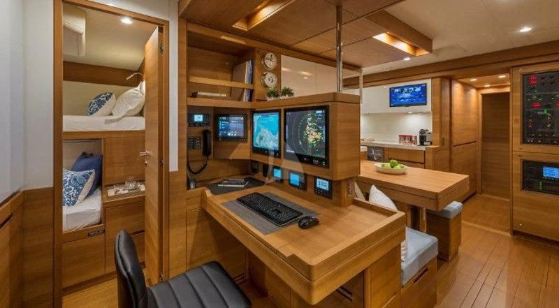 a room with computers and monitors aboard FARFALLA Yacht for Sale