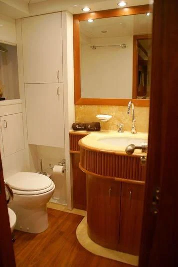 a bathroom with a sink and a toilet aboard AMANZI Yacht for Sale