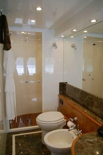 a bathroom with a shower and sink aboard AMANZI Yacht for Sale