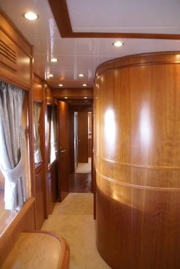 a hallway with wood cabinets aboard AMANZI Yacht for Sale