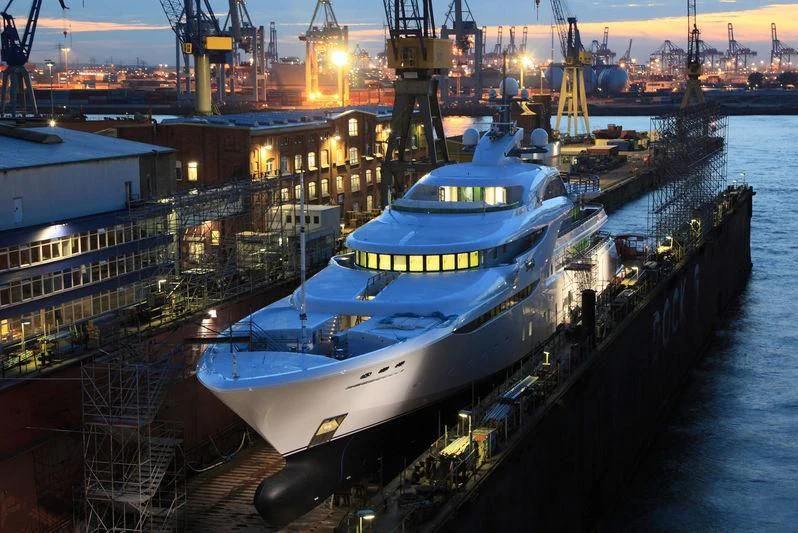 a large ship docked at a harbor aboard KOSATKA Yacht for Sale