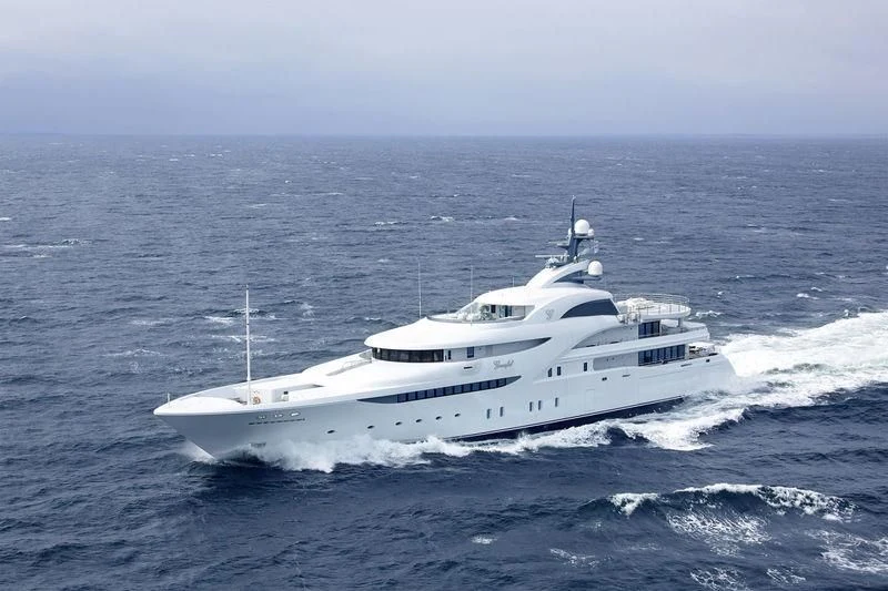 a white yacht in the ocean aboard KOSATKA Yacht for Sale