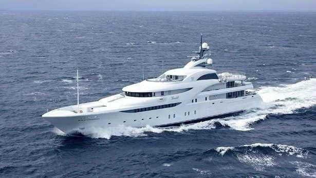 a white yacht in the ocean aboard KOSATKA Yacht for Sale